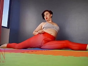 Regina Noir. A woman in yoga leotards practices yoga in the gym. Transparent red leotard yoga. Pantyhose C1